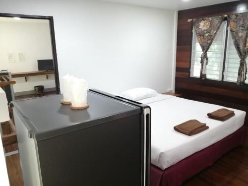 Postel nebo postele na pokoji v ubytování Jansom Beach Resort