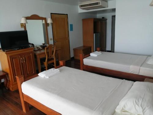 Postel nebo postele na pokoji v ubytování Jansom Beach Resort