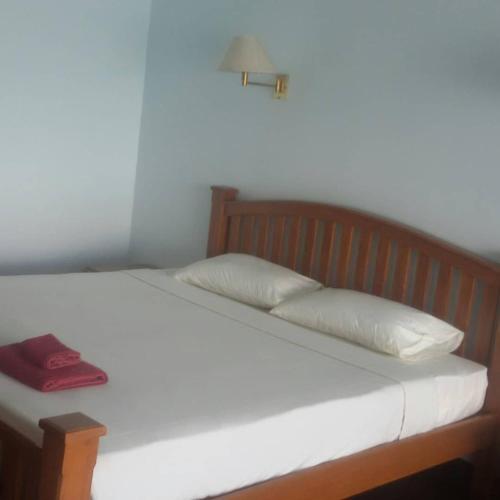 Postel nebo postele na pokoji v ubytování Jansom Beach Resort