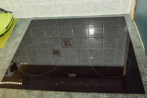 a stove top oven with circles on it at Andriannas apartment-parking lot included in Patra