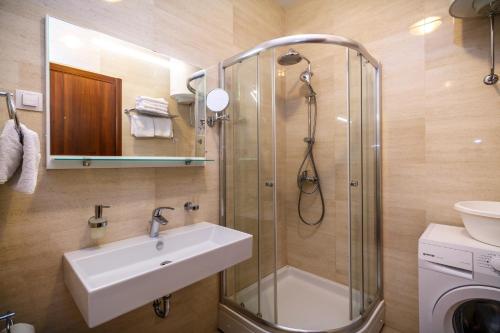 a bathroom with a sink and a shower at Luxury Budva Center Apartments in Budva