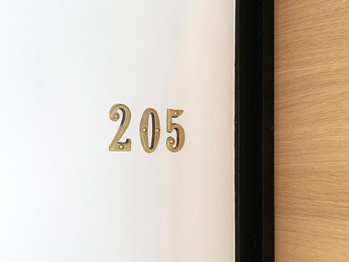 a door with the number on it at Cactus Inn in Miyazaki