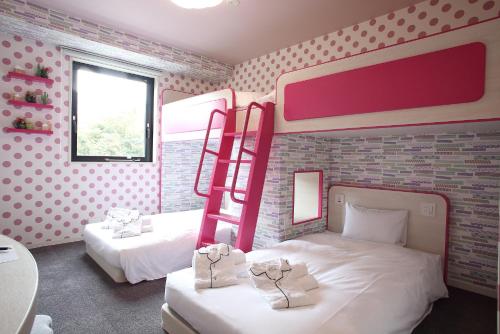 Katil atau katil-katil dalam bilik di HOTEL EURASIA MAIHAMA ANNEX
