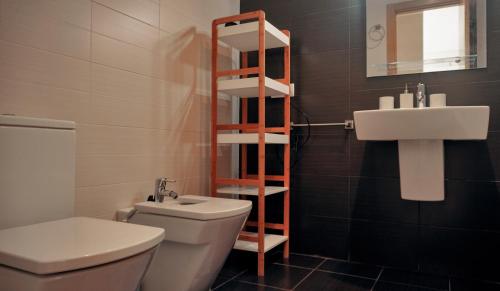 a bathroom with a toilet and a sink at Okeanos sea view 1 bedroom VR-S in Granadilla de Abona