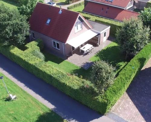 an aerial view of a house with a river at Vakantiewoning Seaewald in Zeewolde