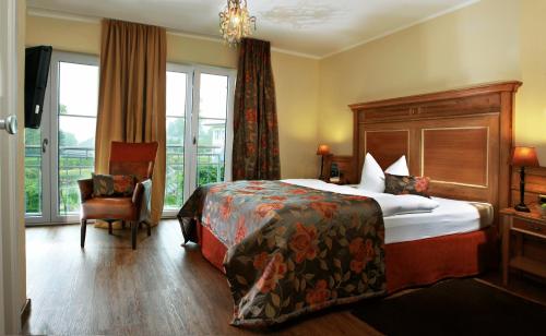 Postel nebo postele na pokoji v ubytování Ampervilla Hotel