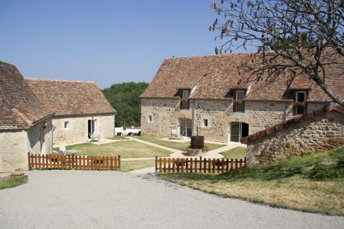an old stone building with a fence in front of it at Domaine de Janis & Spa in Le Vigan