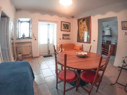 a dining room with a table and chairs at Villa Maremonti in Taormina