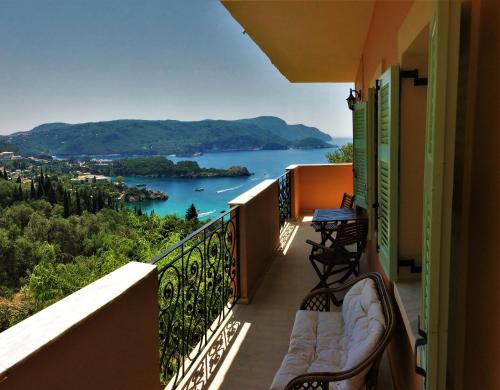 a balcony with a view of a lake at Villa Amaryllis in Paleokastritsa