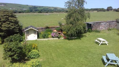 an aerial view of a garden with a table and a bench at Chestnuts Bed and Breakfast in Whitehaven