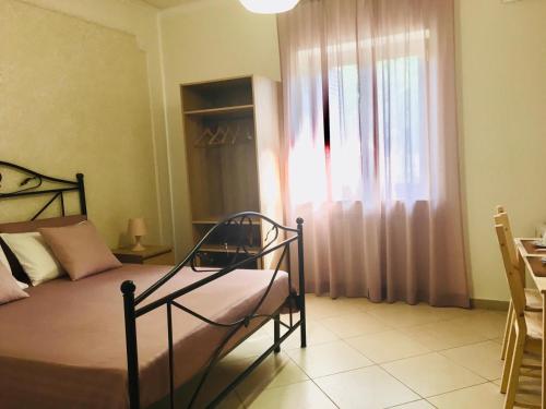 Postel nebo postele na pokoji v ubytování B&B LA PIETRA