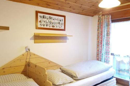 Postel nebo postele na pokoji v ubytování Cesa DOLOMITI