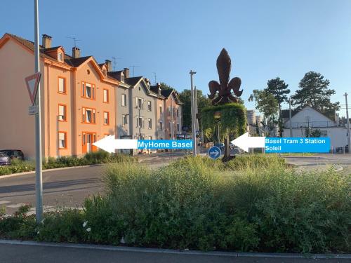 a street with street signs in a town with buildings at MyHome Basel 1A44 in Saint-Louis