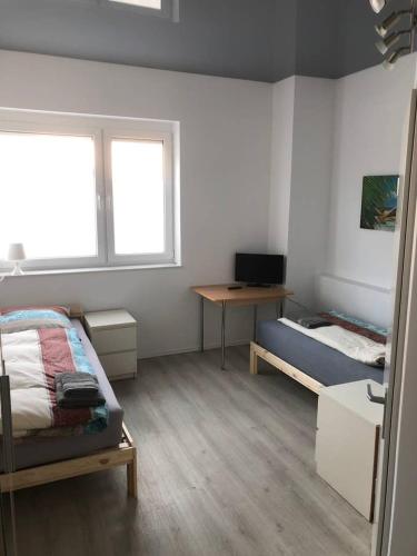 TV a/nebo společenská místnost v ubytování Zimmer 5
