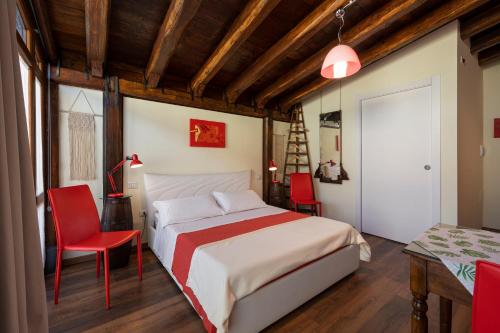 a bedroom with a bed and a table and chairs at Agriturismo Monte Cologna in Foligno