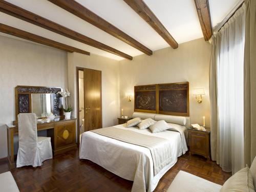 Postel nebo postele na pokoji v ubytování Hotel Campiello