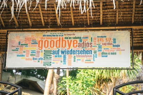 a sign for a restaurant with words on it at The Three Shooting Stars in Panglao