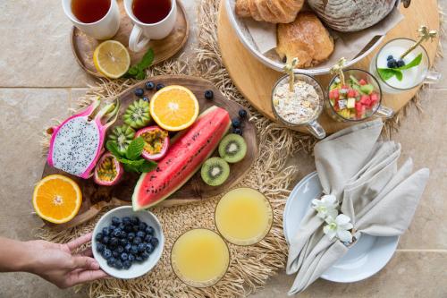 a table with a bunch of different types of breakfast foods at Baan Lily in Chaweng