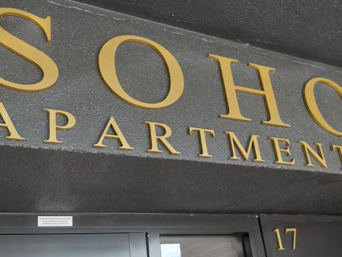 a sign for the entrance to the department of fire department at Cosmopolitan at SoHo in Gerringong