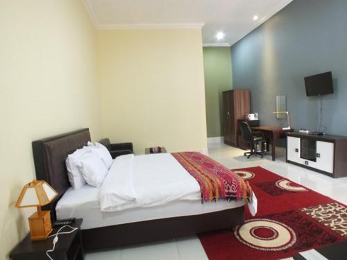 Postel nebo postele na pokoji v ubytování GLOBAL VIEW HOTEL
