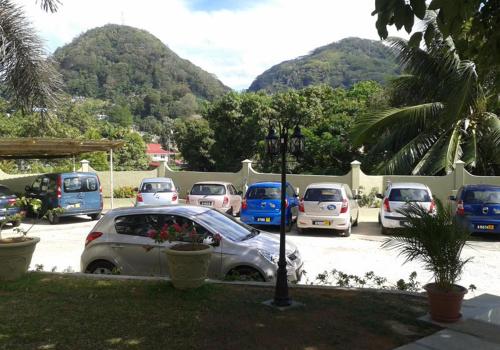 a bunch of cars parked in a parking lot at Bel Air Hotel in Victoria