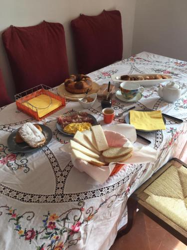 a table with plates of food on it at Villa Lilia by Let in Siena