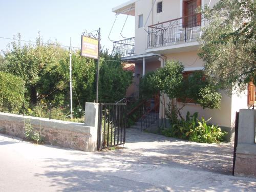 a building with a gate in front of it at Eleni Studios & Apartments in Mithymna