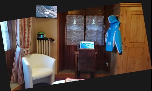 a room with a table and a chair and a window at Le Dôme in Tignes