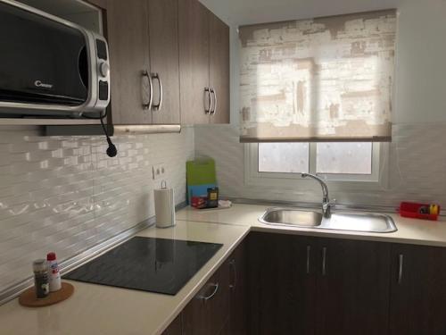 Cuisine ou kitchenette dans l'établissement Apartamentos cerca del Aeropuerto