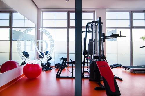 a gym with treadmills and exercise equipment in a room at Hotel Wellness & Spa Nowy Dwór in Rzeszów