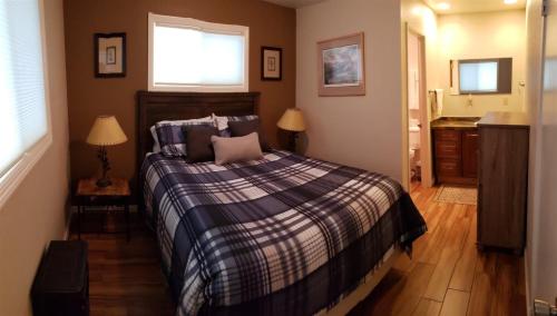 a bedroom with a bed and a window at Birch Creek #1 - 1BR/1BA - Down Canyon in June Lake