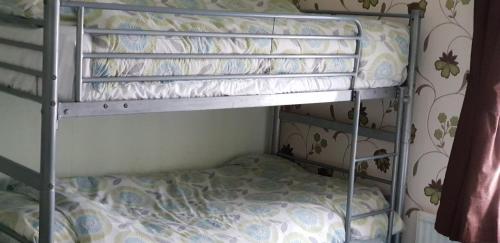 a bunk bed in a room with a bunk bedscribed at Tobermory Hotel in Blackpool