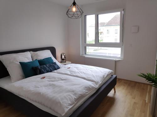 Postel nebo postele na pokoji v ubytování City Appartement Wien-Schwechat