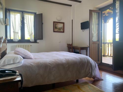 Postel nebo postele na pokoji v ubytování Hotel Siglo XVIII