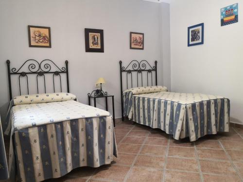 En eller flere senger på et rom på Villa Hierbabuena