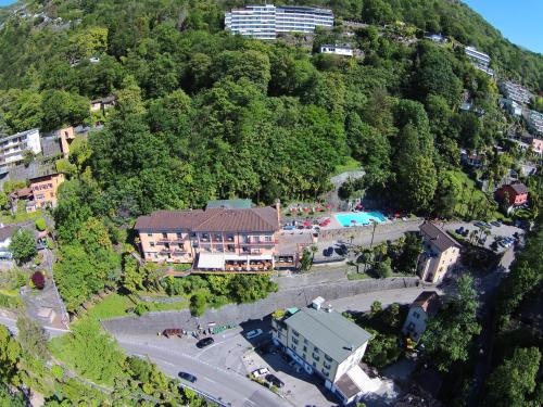 an aerial view of a resort on a mountain at Hotel Arancio in Ascona