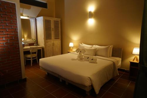Voodi või voodid majutusasutuse Olinia Airport Hotel toas