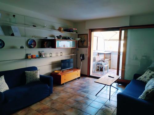a living room with a couch and a table at Lovely Grado in Grado