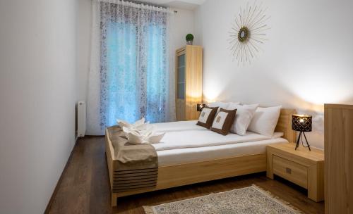 Un ou plusieurs lits dans un hébergement de l'établissement Colours Apartments Budapest