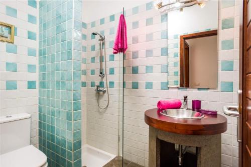 a bathroom with a sink and a shower at Villa Corito in Playa Blanca