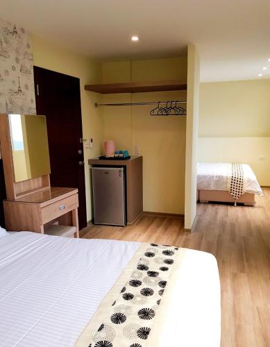 Ένα ή περισσότερα κρεβάτια σε δωμάτιο στο Night Sea Homestay