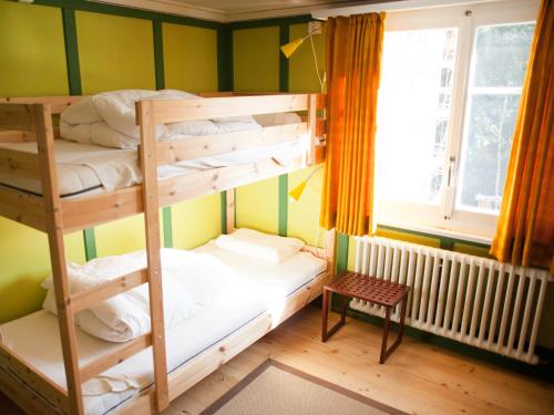 Llit o llits en una habitació de Nangijala Hostel