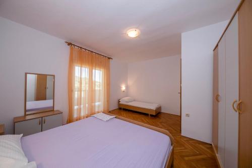 Posteľ alebo postele v izbe v ubytovaní KUĆA LEONORA
