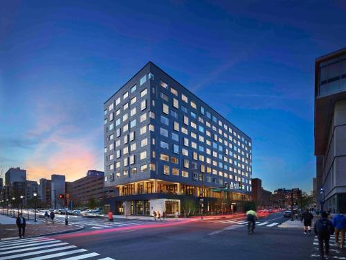 a tall building with windows on a city street at The Study at University City, Study Hotels in Philadelphia