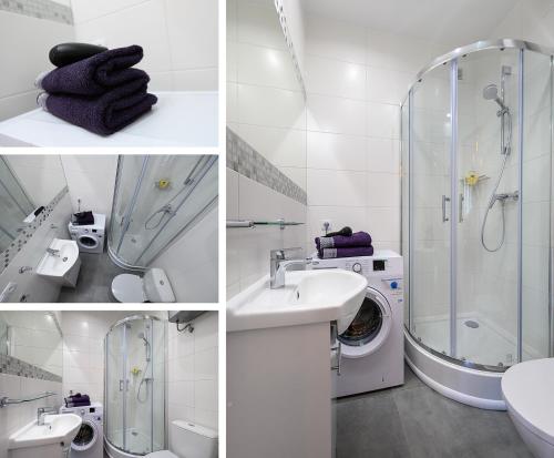 a bathroom with a shower sink and a washing machine at Apartamenty Bałuty PARK in Łódź