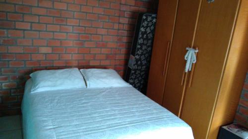 Cama ou camas em um quarto em Casa simples Serra gaúcha