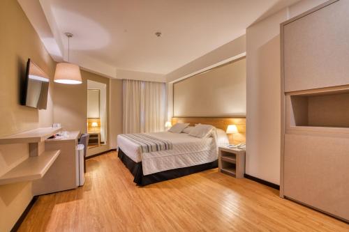 Cama ou camas em um quarto em Viale Cataratas Hotel & Eventos