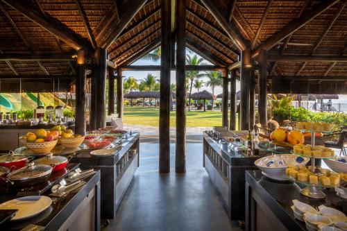 a buffet line with many plates of food at Wish Natal in Natal