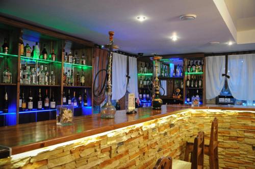 a bar with lots of bottles of alcohol at Hotel Akkerman in Oryol