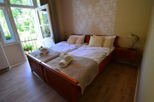 Postel nebo postele na pokoji v ubytování Baronka Bed & Breakfast & Bistrot